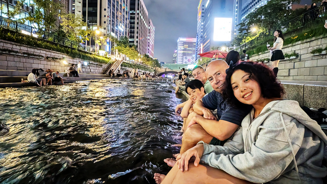 Zoey with her younger brother, Dylan, and dad, Jeremy, at a river near their hotel