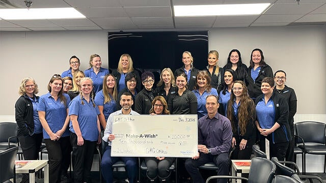 The staff of GKG Orthodontics presents its donation to wishes.