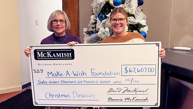Naley McKamish, director of marketing presenting a $67,607 donation to Stephanie Pugliese, Make-A-Wish Director of Development.