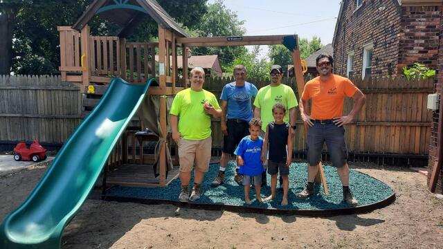 wish kid Shai and the builders who put his playset together