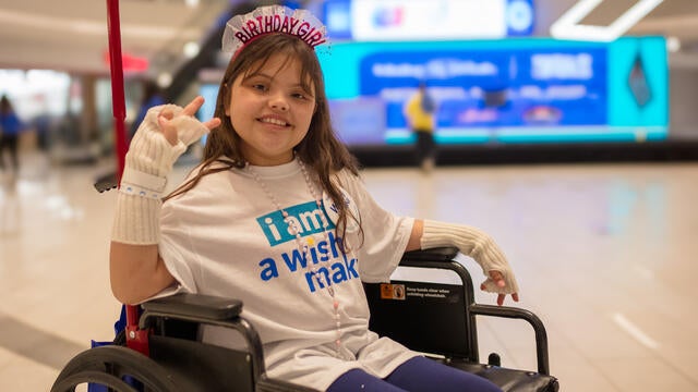 Photo of a wish kid in a wheelchair
