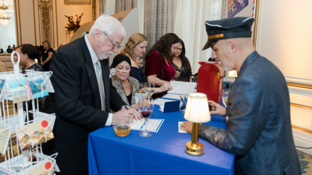 Guests write heartfelt postcards at our Airmail for Wish Kids station, sending joy and encouragement to wish kids on their upcoming wish trips.  