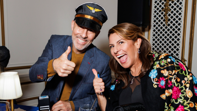 Event volunteer Pablo Iturralde adds a stamp Dr. Diana Bojorquez’s A World of Wishes passport at our Airmail for Wish Kids station. 