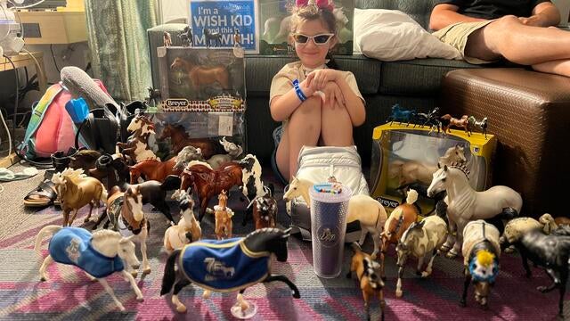 Ella holding a Breyer horse