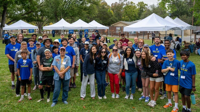 Volunteers gather on the lawn the morning of Walk for Wishes