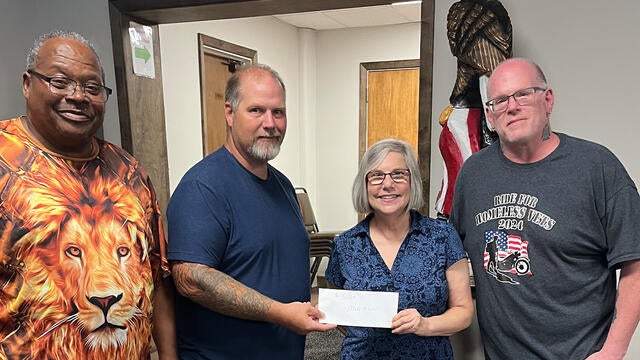 Board member of New Kensington Eagles Aerie 533 presenting their donation.