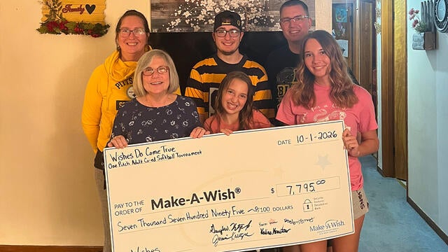The Kreutzer family presenting their donation from this year's softball tournament