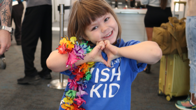 Payson leaves the airport for her wish to visit Hawaii.
